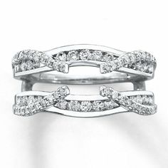 two white gold wedding rings with diamonds on each band and an intertwined design in the middle