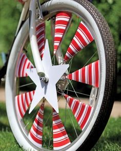 a close up of a bike wheel with red and white stripes