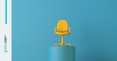 a yellow office chair sitting on top of a blue pedestal in front of a blue wall