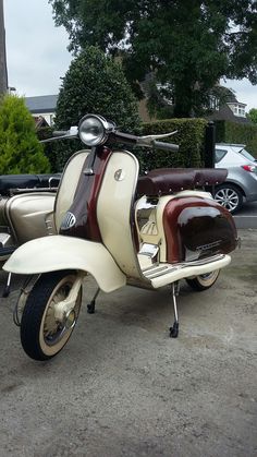 a motor scooter is parked in a parking lot