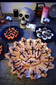 a table topped with lots of halloween treats