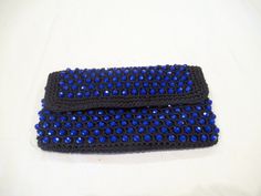 "This black fabric clutch with blue beads is by the Emporium and it snaps closed.  It measures 8-3/4\" wide and 5\" tall and was made in Italy.  The snap is coming loose, otherwise very nice.  From smoke free home." Rectangular Blue Beaded Clutch, Blue Beaded Clutch Evening Bag, Blue Beaded Evening Bag For Formal Occasions, Handmade Blue Evening Bag, Handmade Blue Clutch For Formal Occasions, Handmade Blue Clutch For Formal Events, Handmade Blue Evening Bag For Formal Occasions, Blue Beaded Evening Bag For Party, Formal Handmade Blue Clutch