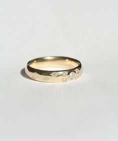 In stock in size 10.75 and custom sized in 5-7 days. This wedding band was inspired by a 17th century gold hoop ring. Gently rounded, weighty, and high in quality. Each piece is individually handcrafted for the wearer, and left with a human touch from the maker. Interiors can be personally inscribed. Reclaimed diamonds were infused into this piece. Specifications: 14k yellow gold band, 5mm band, almost 0.4ct reclaimed diamonds 3mm- 1.5mm VS For engraving, you can leave a note with your request w Champagne Diamonds Engagement, Band With Diamonds, Band Rings Women, Handmade Wedding Band, Wedding Band Engraving, Human Touch, Traditional Engagement Rings, Round Engagement Rings, Vintage Wedding Band