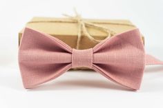 "Pink color pre-tied wedding bow ties for groomsmen gift / Ring bearer bow tie Details Material - 100% Linen. Pre-Tied Bow Tie. Handmade - Made To Order. Packaged in a gift box. Bow Tie Sizes Pre tied Adult bow tie: Attached to an adjustable strap fitting approx 13 inch - 19 inch neck size Bow tie size - Width: 12cm / 4,7\" | Height: 6cm / 2,4\" (For 17 yrs up to adult's) Pre tied Youth bow tie: Attached to an adjustable strap fitting approx 10 inch - 15 inch neck size Bow tie size - Width: 10 c Pink Groomsmen, Groomsmen Grey, Wedding Bow Tie, Burnt Orange Weddings, Groomsmen Bowtie, Baby Bowtie, Kids Bow Ties, Boys Bow Ties, Pre Tied Bow Tie