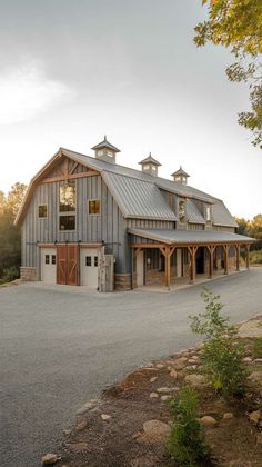 Barndominium Garage Door Living Room for an Open-Air Feel Roofing Options, Geothermal Heating, Passive Solar Design, Living Area Design, Metal Siding, Barndominium Floor Plans, Siding Materials, Smart Home Technology, Weathered Wood