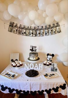 a mickey mouse themed birthday party with balloons