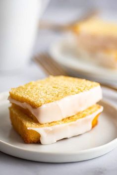 two pieces of cake sitting on top of a white plate