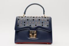 Length: 9" Height: 7" Width: 4.5" Full length of the strap : 41" Infanta Navy Blue Spike Leather Handbag: Elegance Beyond the Horizon Understated Majesty: Immerse yourself in the allure of the Infanta Navy Blue Spike Leather Handbag, meticulously crafted from 100% high-quality calf leather, bringing forth an essence of understated majesty in every detail. Artistic Spike Embellishments: The flap boasts meticulously placed navy blue and gold spikes, creating an artistic arrangement that adds a dar Luxury Navy Shoulder Bag With Handles, Navy Formal Shoulder Bag With Detachable Strap, Formal Navy Shoulder Bag With Detachable Strap, Navy Shoulder Bag With Detachable Strap For Evening, Navy Evening Bag With Detachable Strap, Designer Navy Bag For Evening, Navy Rectangular Shoulder Bag For Evening, Designer Navy Evening Bag, Navy Rectangular Evening Shoulder Bag