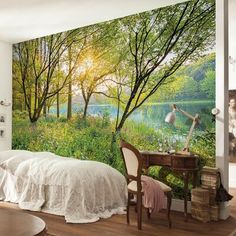 the bedroom is decorated in white and has an image of a woman walking through the woods