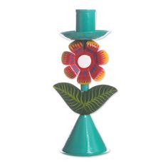 a blue vase with a flower and a green top hat on it's head