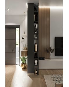 a living room filled with furniture and a flat screen tv on top of a wooden shelf