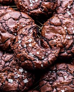 chocolate cookies with white sprinkles on a cooling rack