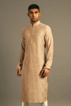 Beige kurta with geometric embroidered motifs and front potli placket. Paired with churidar.
Component: 2
Embroidered
Neckline: Mandarin
Sleeve Length: Full
Fabric: Cotton Silk Chanderi
Color: Beige
Front potli placket - Aza Fashions Beige Kurta, Kurta Set Men, Men Kurta, Kurta Set For Men, Embroidered Motifs, Embroidered Neckline, Churidar, Kurta Set, Cotton Silk