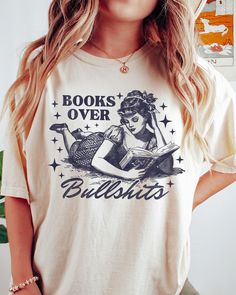 Books Over Bullshits Shirt, Book Shirt, Book Lover T-Shirt, Women Reading Shir, Book Club Tee, Book Shirt For Women Reading Shirt, Book gift -UNISEX T-SHIRTS - Women typically wear one size down for a fitted look. -The Models in the pictures are wearing 2 sizes up, Please order 2 sizes up for an oversized look DETAILS AND FABRIC: * Comfort Colors 1717 * 100% ring-spun cotton How you order: Select your size and the color that you want from the drop down bar, add to cart, and check out.  How to or Women Reading, Book Shirt, Reading Shirts, Book Gift, Woman Reading, Book Shirts, Shirts Women, Shirt For Women, T Shirt Women