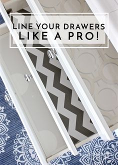 an open drawer with the words line your drawers like a pro on it and a chevron blue rug