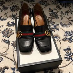 Gucci Loafers With Heel. Size 37. The Bottoms Have Been Worn. Creases In The Front, Minimal Scratch Not Noticeable. In Good Condition Overall Gucci Leather Sole Evening Loafers, Gucci Evening Loafers With Leather Sole, Elegant Gucci Pointed Toe Loafers, Classic Gucci Loafers For Evening, Gucci Almond Toe Heels For Office, Classic Gucci Evening Loafers, Gucci Leather Heels For Business, Designer Square Toe Loafers For Workwear, Designer Square Toe Office Heels