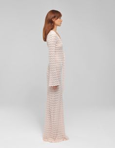 Materials: Knit nylon cottonColors: PinkDescription: Knitted long dress featuring front cut-outs and strap detailDetails Long dress Cut out upfront with strap detail V neck Long sleeves Model wearing: SMADE IN ALBANIA BUST WAIST HIPS (cm)XS 84 64 94S 88 68 98M 94 72 102L 102 78 106XL 108 84 110CUSTOM SIZE: We can make any design custom based on your measurements. Customization is offered also about color and some design. Feel free to write us a message. Floor-length Crochet Summer Dress, Chic Spring Open Knit Maxi Dress, Chic Open Knit Maxi Dress For Spring, Chic Spring Midi Dress With Open Knit, Chic Crochet Dress With Pointelle Knit And V-neck, Fitted Open Knit Midi Dress For Spring, Fitted V-neck Open Knit Dress, Fitted Chic Maxi Dress With Open Knit Details, Spring Evening Knit Maxi Dress