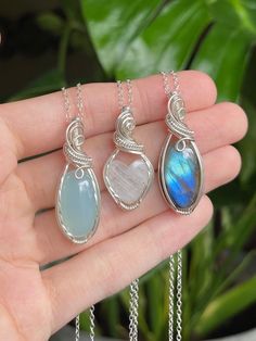 "💙🌊 Ocean Blues Crystal Necklaces 🌊💙 * Wrapped in Sterling Silver wire✨ Chalcedony: 1 1/2\" tall Rainbow Moonstone: 1 5/16\" tall Labradorite: 1 1/2\" tall  * Each necklace comes with an 18\" Sterling Silver chain  🌿 Follow me on Instagram & TikTok @crystal.lune" Sterling Silver Pendant Crystal Necklace With Gemstone Beads, Sterling Silver Jewelry With Gemstone Beads, Silver Sterling Silver Crystal Necklaces With Natural Stones, Sterling Silver Crystal Necklace With Gemstone Beads Gift, Sterling Silver Gemstone Beads Jewelry For Healing, Spiritual Sterling Silver Crystal Necklace With Gemstone Beads, Healing Sterling Silver Jewelry With Gemstone Beads, Sterling Silver Crystal Necklaces With Gemstone Beads, Sterling Silver Gemstone Beads Jewelry As Gift