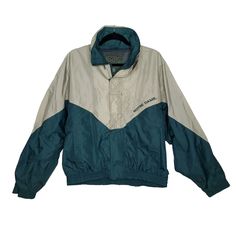 Vintage Notre Dame Windbreaker Jacket Sz M Green Tan Zip Up w/ Hook & Loop Closure, Stow Away Hood Approximate Flat Measurements Underarm to Underarm: 25" Overall Length From Back of Neck: 26" Not much elasticity left in sleeve cuffs - 5.25" Flat Width Retro Hooded Track Jacket For Outdoor, Green Track Jacket With Adjustable Hood For Winter, Retro Long Sleeve Windbreaker For Outdoor Activities, Green Casual Nylon Hooded Jacket, Casual Green Windproof Hooded Jacket, Retro Nylon Outerwear For Outdoor Activities, Retro Winter Track Jacket For Outdoor Activities, Green Nylon Hooded Jacket Casual, Retro Outdoor Track Jacket With Long Sleeves