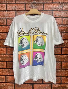 "Vintage 90s Marilyn Monroe Pop Art Style Handprinted T Shirt / Andy Warhol / Vintage Punk T Shirt Size L Condition : Good Used Size on tag : L Colour : White Brand : Unknown Measurement : Armpit to armpit -22\" Length - 26.5\" Material : Old Cotton Made In: Usa THE SHIPPING (Your Choice Please read) 1. The shipping cost is USD 20 via Malaysian Registered Postage With Tracking Number. It will take 2-4 weeks or more for delivery, depends on your custom checking. 2. Add USD 10 for speedy delivery Grunge Multicolor T-shirt For Streetwear, Multicolor Grunge T-shirt For Streetwear, Grunge Multicolor Streetwear T-shirt, White Retro T-shirt With Graffiti Print, Vintage Multicolor Graffiti Print T-shirt, Grunge Style Multicolor Screen Print T-shirt, Multicolor Grunge T-shirt With Screen Print, Vintage White T-shirt With Graffiti Print, Vintage Multicolor Graffiti T-shirt