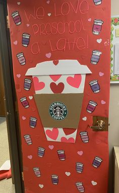 a door decorated to look like a coffee cup with hearts and the words we love preschool at school