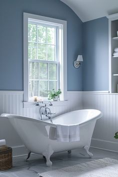 a white bath tub sitting next to a window