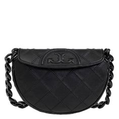 Tory Burch Crossbody. SKU: 162265-001. Color: Black. Size: W: 9" x D: 1.9" x H: 5.9". Tory Burch Black Leather Fleming Soft Mini Crescent Bag. This crescent-shaped bag features a textured diamond pattern, an iconic trapunto logo, and a bold chain-link shoulder strap, with a magnetic-snap flap closure, a removable and adjustable crossbody strap, and an interior wall pocket. Outer: Calf Leather 100%. Tory Burch Fleming, Crescent Bag, Tory Burch Crossbody, Versace Watch, Cheap Gifts, Crossbody Messenger Bag, Mini Handbags, Mini Shoulder Bag, Black Crossbody