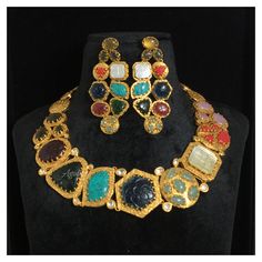 *Material: Brass *Plating: 22K Gold Plated *Stone: Semi Precious Gemstones *DIMENSIONS * *Necklace : Weight 83 gm *Earrings : Length 2.75 Inches , Width 1.25 Inches , Weight 15 gm Each *ABOUT PRODUCT* *This is a High Quality Navratan Necklace Set. *Style Tip : If you like both Traditional and contemporary... This set is certainly for you. *DISCLAIMER* *Product & color may slightly vary due to photographic lighting sources or your screen settings. Bollywood Style 22k Gold Jewelry For Navratri, 22k Gold Cutdana Jewelry For Navratri, Gold Plated Bollywood Style Necklace, Gold Plated Heavy Bollywood Necklace, Heavy Gold Plated Bollywood Necklace, Bollywood Style Necklace With Intricate Design For Celebration, Multicolor 22k Gold Jewelry With Cutdana, Heavy Bollywood Style Gold-plated Necklace, Multicolor 22k Gold Cutdana Jewelry