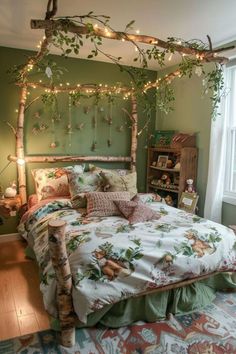 a bedroom decorated in green and white with lights on the headboard, bedding and pillows