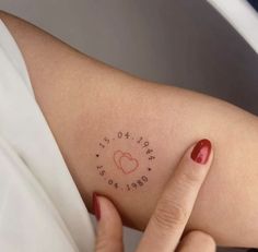 a woman's arm with writing on it that reads, love is all around us