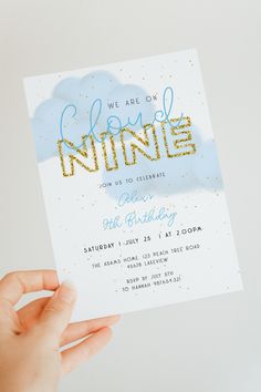 someone holding up a card with the words we are on infinite written in gold glitter