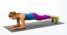 a woman is doing push ups on a mat