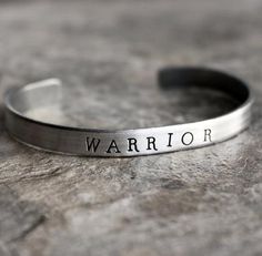 Warrior Hand Stamped Cuff Bracelet in Silver Hand stamped aluminum cuff bracelets are adjustable! Handmade by Neon Bison, available at the Bullish Shop White Elephant Gag Gifts, Warrior Bracelet, David Howell, Women Stickers, Gifts Aesthetic, Hand Stamped Cuff Bracelet