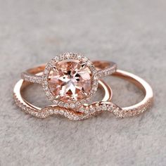 two rose gold wedding rings with an oval morganite surrounded by diamonds