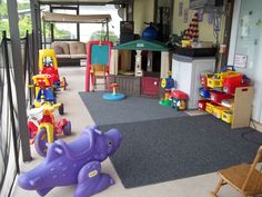 an indoor play area with toys and furniture