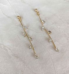 Romantic rhinestones dangle earrings for your special event. SY-2566 DETAILS -they measure about 7cm(2.75") long and .5cm(0.19") wide. -cubic zirconia, rose gold alloy NEED MORE HELP? I'm happy to provide advice or recommendations; just send me a message! SHOP MORE STYLES: https://www.etsy.com/shop/AdoraCoutureStore?ref=seller-platform-mcnav SHIPPING: EUROPE: 4 - 12 working days , outside EUROPE: 8 - 20 working days. For the fastest delivery, please select Express shipping during checkout. CANCE Dangle Rhinestone Bridal Earrings As Gift, Dangle Bridal Earrings With Rhinestones, Bridal Dangle Earrings With Rhinestones, Sparkling Crystal Dangle Diamond Earrings, Elegant Crystal Earrings For Celebration, Gift Bridal Earrings With Rhinestones In Drop Shape, Gift Bridal Drop Earrings With Rhinestones, Bridal Drop Earrings With Rhinestones, Gold Delicate Crystal Earrings For Party