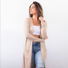 Duster Cardigans Are One Of Our Favorites For So Many Reasons! Not Only Are They Seasonally Neutral But They Add Instant Style And Trend To Any Look! Whether You Want To Complete A Look With Denim Shorts Or Layer Over A Short Dress, You Will Feel More Comfortable With A Duster Cardigan. Our Gorgeous Pocketed Duster Cardigan Is A Perfect Summer Lightweight Layer In This Ultra Brushed Soft Texture. A Soft Knit Style With Long Sleeves That Can Be Easily Rolled And An Ethereal And Versatile Vibe Versatile Cardigan With Pockets For Spring, Fitted Open Front Outerwear For Everyday, Long Spring Cardigan For Everyday Wear, Long Spring Cardigan For Everyday, Everyday Long Spring Cardigan, Duster Cardigan, Knit Style, Soft Texture, Tan Color