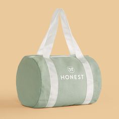 Our adorably sized Honest Duffel Bag lets you (or your mini!) stash + carry your Honest essentials to go in a sporty style! Large Capacity Sporty Travel Accessories For Everyday Use, Sporty Large Capacity Travel Accessories For Everyday Use, Sporty Travel Accessories With Large Capacity For Everyday Use, Sporty Green Everyday Bag, Green Sporty Bag For Daily Use, Sporty Green Bag For Daily Use, Trendy Green Sports Bags, Green Large Capacity Sporty Travel Bag, Sporty Green Travel Bag With Large Capacity