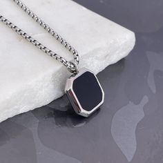 "Elevate her style with our Black Onyx Stone Necklace for Men, a stainless steel pendant ready for custom engraving. The perfect gift designed for her, these handmade jewelry pieces add sophistication to any look. Express your love with a special message, initials, or date, and make it a special treasure. Convey individuality and charm with a timeless piece. Presented in a durable and stylish style, this makes a lovely Valentine's Day gift for a husband or lover. \"Personalize Your Style\" and m Elegant Stainless Steel Necklace For Father's Day, Black Engraved Rectangular Pendant Necklaces, Minimalist Black Jewelry With Engraving Option, Black Engraved Rectangular Pendant Necklace, Personalized Black Metal Necklaces, Minimalist Stainless Steel Necklace For Father's Day, Black Sterling Silver Tarnish Resistant Necklace, Black Jewelry With Engraving Option For Father's Day, Silver Stainless Steel Jewelry With Engraving Option