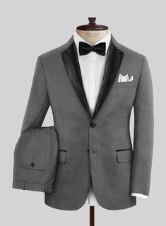 Make an impression at the office or your next formal gathering in our Napolean Gray Wool Tuxedo Suit. Crafted from wool blend, our suit is rendered in soft, wool-rich fabric and finished in a classic gray shade, making you a complete gentleman that grabs attention for his styling.  Featuring satin lapel, matching satin covered buttons and gentle texture at its surface, our tuxedo is a subtle fashion-forward take on a traditional tailoring.  Look Includes   Napolean Gray Wool Fabric  Two Button T Wedding Three-piece Suit With Welt Pockets, Gray Notch Lapel Tuxedo For Formal Events, Gray Notch Lapel Tuxedo For Formal Occasions, Elegant Single Breasted Wool Three-piece Suit, Elegant Wool Three-piece Suit, Single Breasted, Elegant Wool Three-piece Suit Single Breasted, Elegant Single-breasted Wool Three-piece Suit, Semi-formal Gray Tuxedo With Notch Lapel, Gray Tuxedo Suit For Formal Occasions