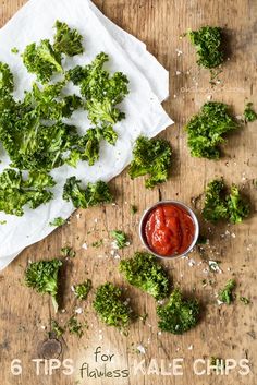 broccoli florets on a wooden table with ketchup