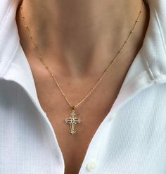 Womens Cross necklace, gold filled cross necklace, gold cross necklace, dainty jewelry, gifts for her, religious necklace, birthday gift Gold filled cross necklace  D E T A I L S: *1"  Gold filled cross pendant with Cubic Zirconia Stones *Gold filled Satellite or Cable chain- choose your perfect length at checkout  *Model wearing 18" length  Water & tarnish resistant!  Gold filled jewelry is durable & tarnish resistant.  Gold filled quality products are suitable for daily wear and is also water Dainty Crucifix Cross Necklace With Delicate Chain, Dainty Cross Necklace For Everyday, Gold Cross Necklace In 14k Gold Filled, Yellow Gold Crucifix Necklace With Delicate Chain, Gold Cross Charm Necklaces In 14k Gold Filled, Gold Dainty Cross Pendant Charms, 14k Gold-filled Gold Cross Pendant Necklace, Gold Cross Pendant Necklace In 14k Gold Filled, 14k Gold Filled Cross Pendant Necklace