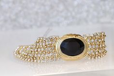 BLACK GOLD BRACELET, Elegant Bracelet, Mother Of The Brides, Wedding Chunky Bracelet, Gold And Black, Formal Jewelry For Women Details of bracelet: Metal: 24K Gold Plated , silver plated or rose gold plated - Nickel Free Gemstone: crystal Length: 3.2 Inch Width: 6.8 Inch if you need other size please write in note The bracelet will be packed in a gift box. , MATCHING EARRINGS CLICK HERE: https://www.etsy.com/listing/570827375/black-tassel-earrings-?ga_search_query=black%2Btassel%2Bearrings&r Glamorous Gold Jewelry For Gala, Luxury Black Bracelets For Wedding, Yellow Gold Jeweled Bracelets For Wedding, Glamorous Gold Bracelets For Evening, Yellow Gold Bracelets With Jewels For Wedding, Elegant Gold Bracelet With 17 Jewels For Parties, Gold Jubilee Bracelet For Evening, Gold Jewel-encrusted Bracelets For Evening, Gold Jeweled Bracelets For Evening