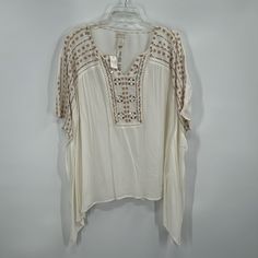 Size: L/Xl Length: 25” Pit To Pit: 30” Lightweight Poncho Blouse From Chicos Perfect For A Fall/Autumn Outing Or Fans Of Boho Style. Features A White Blouse With Tan Embroidered Detailing And Silver Mirror Buttons. This Blouse Has A Flowy, Comfortable Fit Like A Poncho. Arrives To You In Excellent, New Condition With Original Tags! - 100% Rayon - Lightweight - Scoop Neck Down Into A V - Embroidered Pattern Down Front And Sleeves - Poncho, Flowy Fit Be Sure To Check Out My Other Chicos Listings A Flowy White Top For Beach Cover-up, Cream Top For Spring Beach Cover-up, Casual White Poncho With Batwing Sleeves, Casual Beige Spring Poncho, White Bohemian Relaxed Fit Tops, White Batwing Sleeve Blouse For Spring, Casual Flowy Poncho For Spring, Casual Flowy Spring Poncho, Off White Bohemian Short Sleeve Top