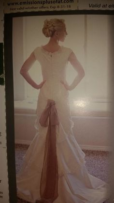 the back of a woman's wedding dress in an advert for fashion plus