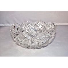 a clear glass bowl sitting on top of a table