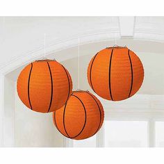 three orange basketballs hanging from the ceiling