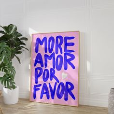 a pink and blue poster with the words more armor for flavor on it next to a potted plant