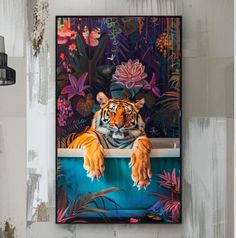 a tiger laying down in a bathtub surrounded by plants and flowers on the wall