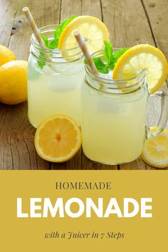 two mason jars filled with lemonade sitting on top of a wooden table next to sliced lemons